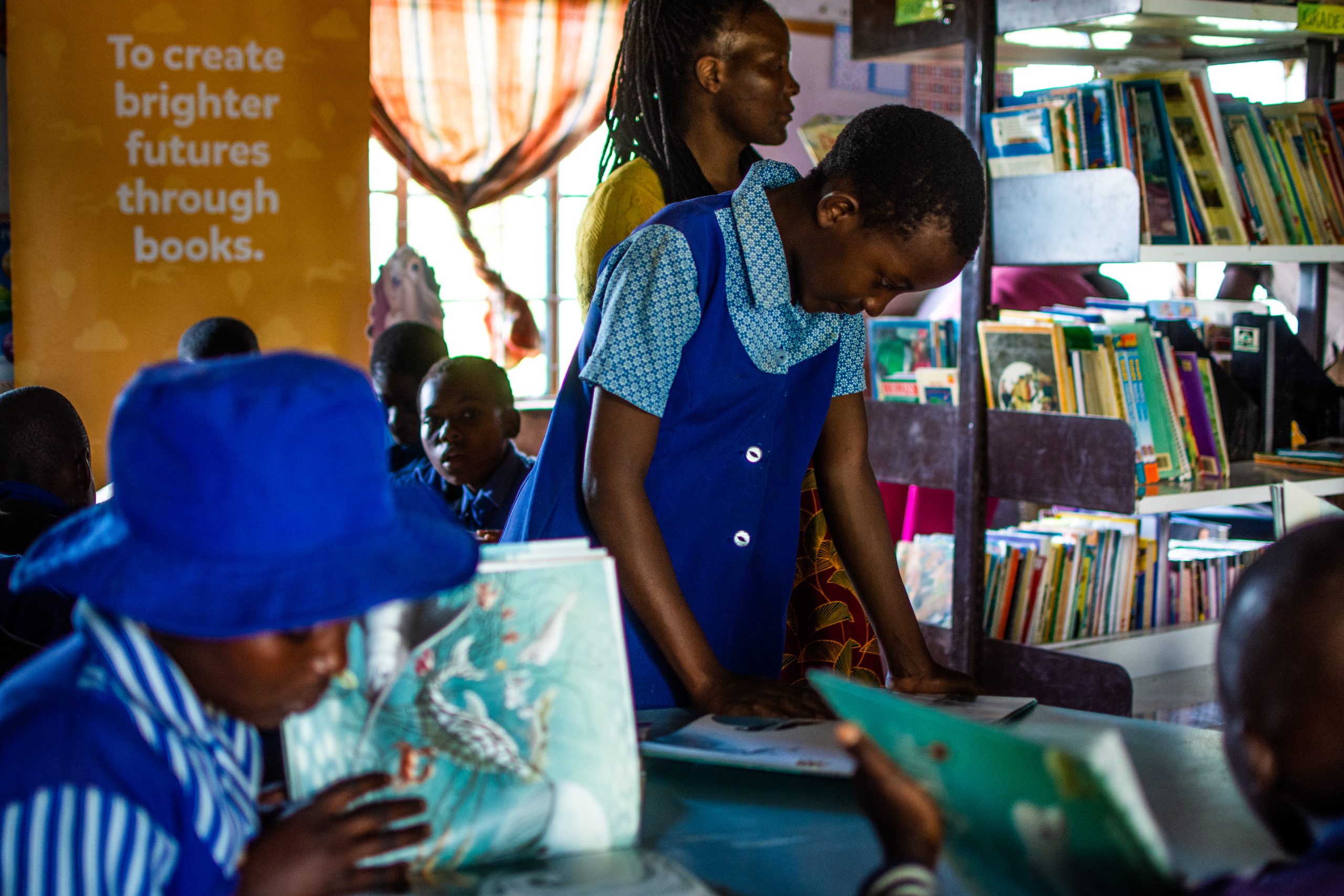 Children with books in a community library
